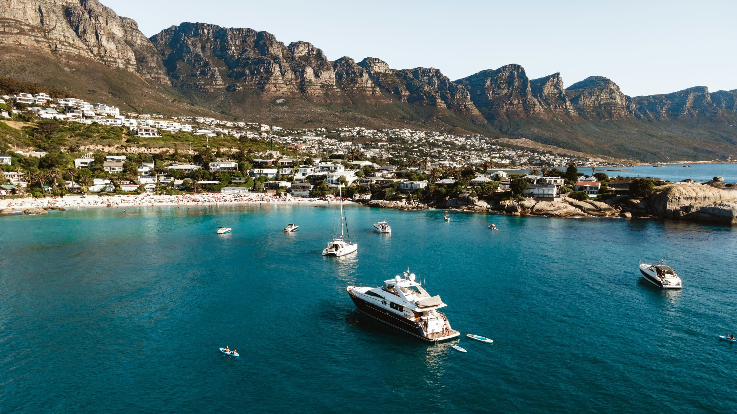 Homes above the bay in Camps Bay, Cape Town, beneath the Twelve Apostles